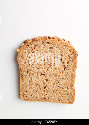 Slice of wholemeal bread on white background, close-up Stock Photo