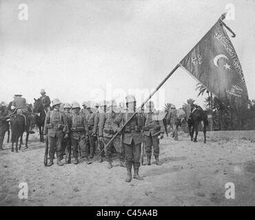 Italian troops in Libya with a captured flag of the Ottoman troops, 1911 Stock Photo