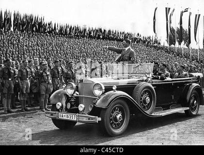 Adolf Hitler drives past Hitler Youth at Reich Party convention, 1934 Stock Photo