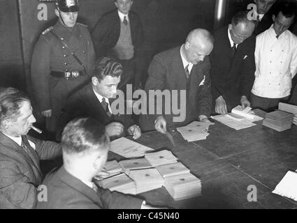 Election workers during the count of votes after the Reichstag ...