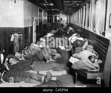 Homeless people stay overnight on a steamer during the Great Depression, 1930 Stock Photo