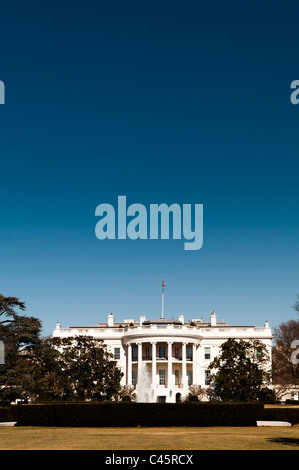 The White House with clear blue sky and portrait orientation. The home and office of the President of the United States, the White House is at 1600 Pennsylvania Ave NW, Washington DC. Stock Photo