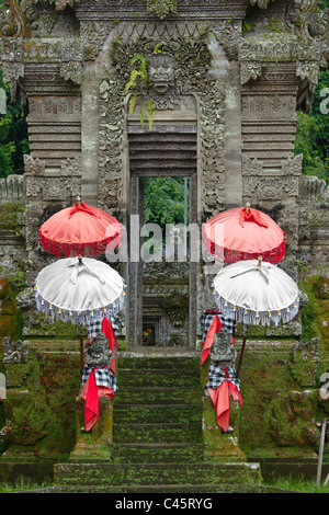 UMBRELLAS grace the entrance to the traditional village of PENGLIPURAN - BALI, INDONESIA Stock Photo