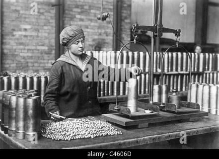 Woman while filling bullets in shrapnel Stock Photo