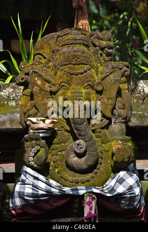 A stone statue of the Hindu deity GANESH - UBUD, BALI, INDONESIA Stock Photo