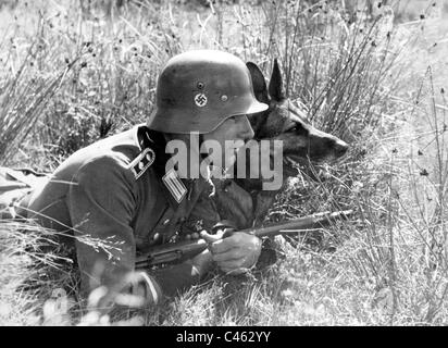German policeman with a German shepherd dog on the Eastern front, 1942 Stock Photo