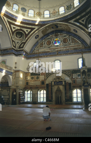 Photograph of a muslem man during a prayer inside the Al Jazar mosque in the old city of Acre Stock Photo
