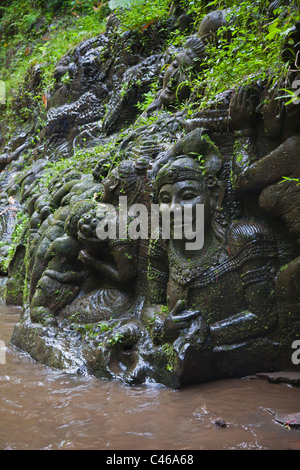 Artisans have carved the story of the RAMAYANA in stone along the banks of the AYUNG RIVER - UBUD, BALI, INDONESIA Stock Photo