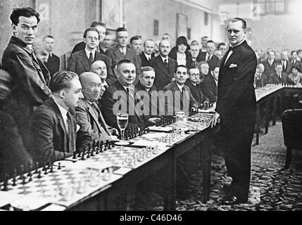 Alexander Alekhine playing simultaneous chess, 1930