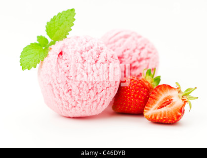 two scoops of strawberry ice cream, strawberry fruit, mint leaf, white background Stock Photo