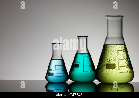 group of three conical flasks containing liquid Stock Photo