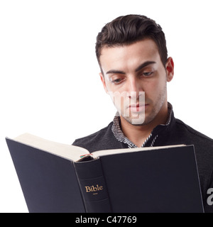 Portrait of a young man reading the Bible Stock Photo