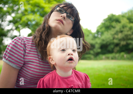 Teenager and baby gazing - supprised Stock Photo