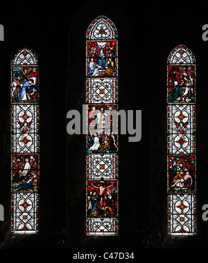 A stained glass window by Clayton and Bell depicting the Passion of Christ, St Nicholas's Church, Tackley, Oxfordshire Stock Photo