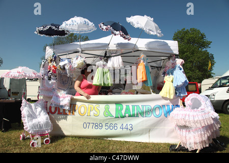 A stall selling baby clothes at the Appleby Horse Fair, Appleby-In-Westmorland, Cumbria, England, U.K. Stock Photo