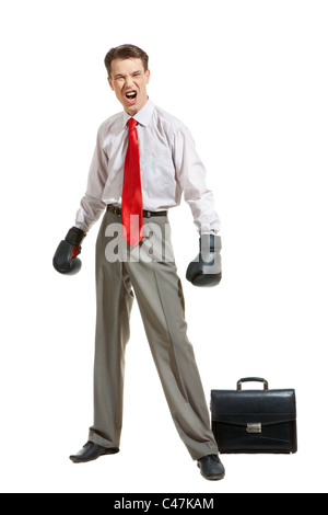 Portrait of aggressive businessman in boxing gloves over white background Stock Photo