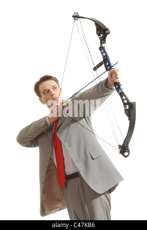 Portrait of concentrated male with crossbow in hands over white background Stock Photo