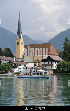 lake Tegernsee and church of city Rottach-Egern nearby Munich in Germany Stock Photo