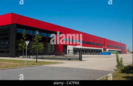 modern red warehouse with office part and loading docks Stock Photo