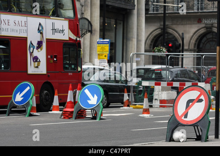 signs and traffic in roadworks in London Stock Photo