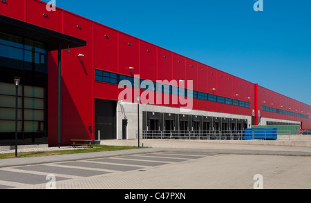 modern red warehouse with office part and loading docks Stock Photo