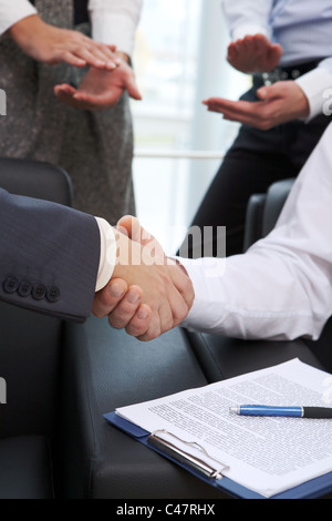 Image of business handshake after signing contract Stock Photo