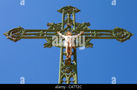 Statue of Jesus on cross with blue sky Stock Photo - Alamy