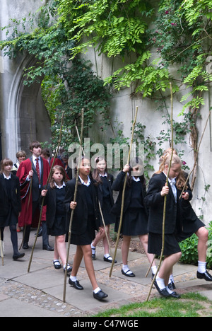 Beating the Bounds Ascension Day at All Hallows by the Tower. City of London School children from St Dunstans College Catford, walking through St Dunstan in the East, church garden, the church is a ruin. 2011 2010s HOMER SYKES Stock Photo