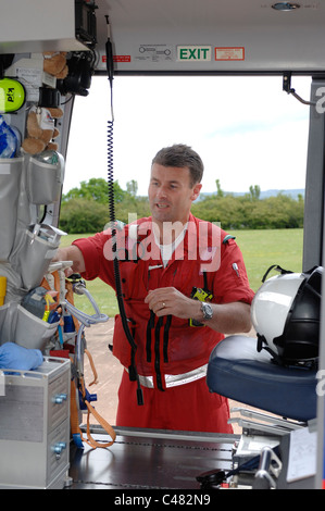 Devon Air Ambulance crew checking kit in Helicopter. Exeter Devon Stock Photo