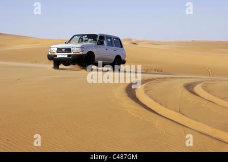 Jeep in the desert sand Stock Photo