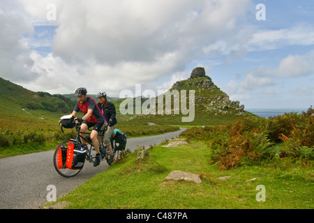 Tandem cyclist by Castle Rock, Valley of the Rocks, Lynton, Devon, Stock Photo