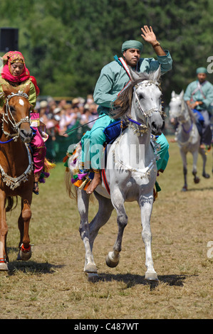 Arabian Royal Cavalry Of Oman In Original Costume On Arabic Horse While 