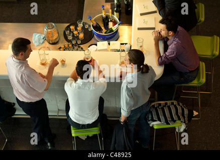 Passengers enjoying a drink before their flight departure, Zurich Kloten Unique Airport (ZRH/LSZH) Switzerland CH Stock Photo