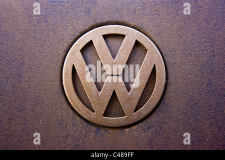 A Volkswagen logo looking rather dirty from the use of the car on which it is featured. (Editorial use only). Stock Photo