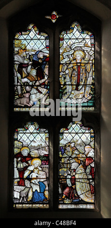 A stained glass window by The Kempe Studios depicting the Annunciation to the Shepherds & Adoration of the Magi Stock Photo