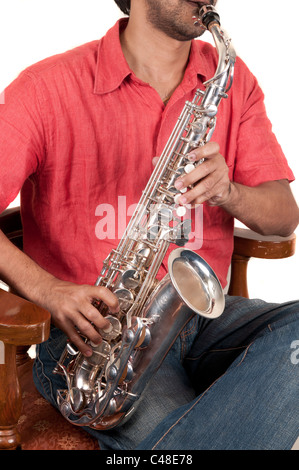 A jazz musician playing saxophone on a white background Stock Photo