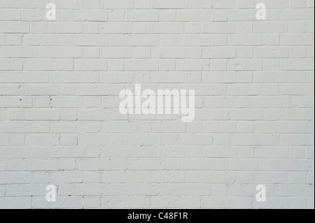 A brick wall that has been cleanly painted in white paint Stock Photo