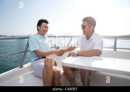 Friends Shaking Hands Stock Photo