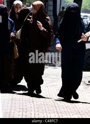 Veiled Arab students walking to their college. Stock Photo