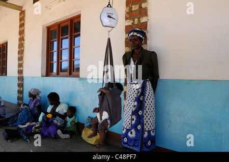 A child is weighed at a medical Center in Africa Stock Photo