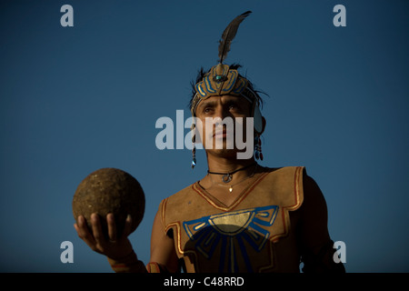 A Mayan ball player holds up the ball made of hule in Chapab village in Yucatan state in Mexico's Yucatan peninsula Stock Photo