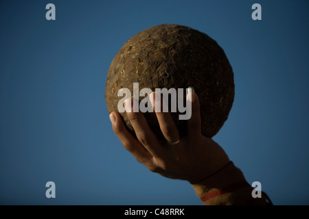 A Mayan ball player holds up the ball made of hule in Chapab village in Yucatan state in Mexico's Yucatan peninsula Stock Photo