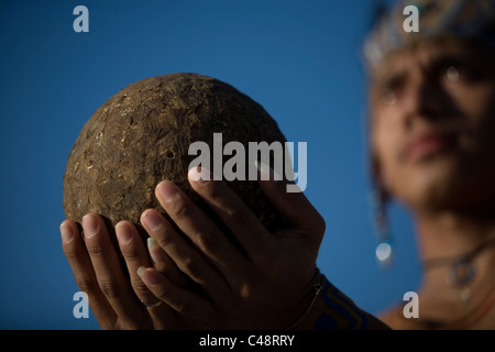 A Mayan ball player holds up the ball made of hule in Chapab village in Yucatan state in Mexico's Yucatan peninsula Stock Photo