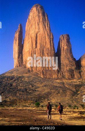 Two men hike to the Hand of Fatima, Mali, West Africa. Stock Photo