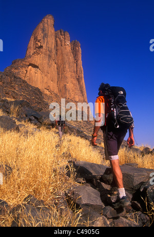 Two men hike to the Hand of Fatima, Mali, West Africa. Stock Photo