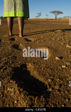 Woman walking barefoot on the lake shore, Spioenkop dam, KwaZulu-Natal, South Africa Stock Photo