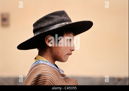 A young cowboy looks pensive, in Chivay en route to Colca Canyon from Arequipa, Peru Stock Photo