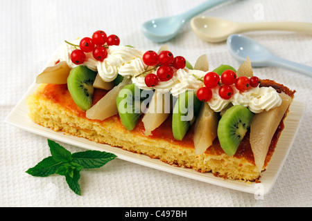 Sponge cake with jam and fruit. Recipe available. Stock Photo