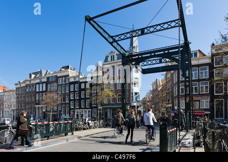 Bridge over the Kloveniersburgwal canal at the end of Staalstraat in the city centre, Amsterdam, Netherlands Stock Photo