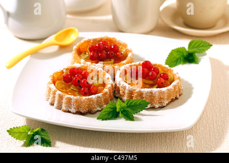 Little citrus fruits tartlets. Recipe available. Stock Photo